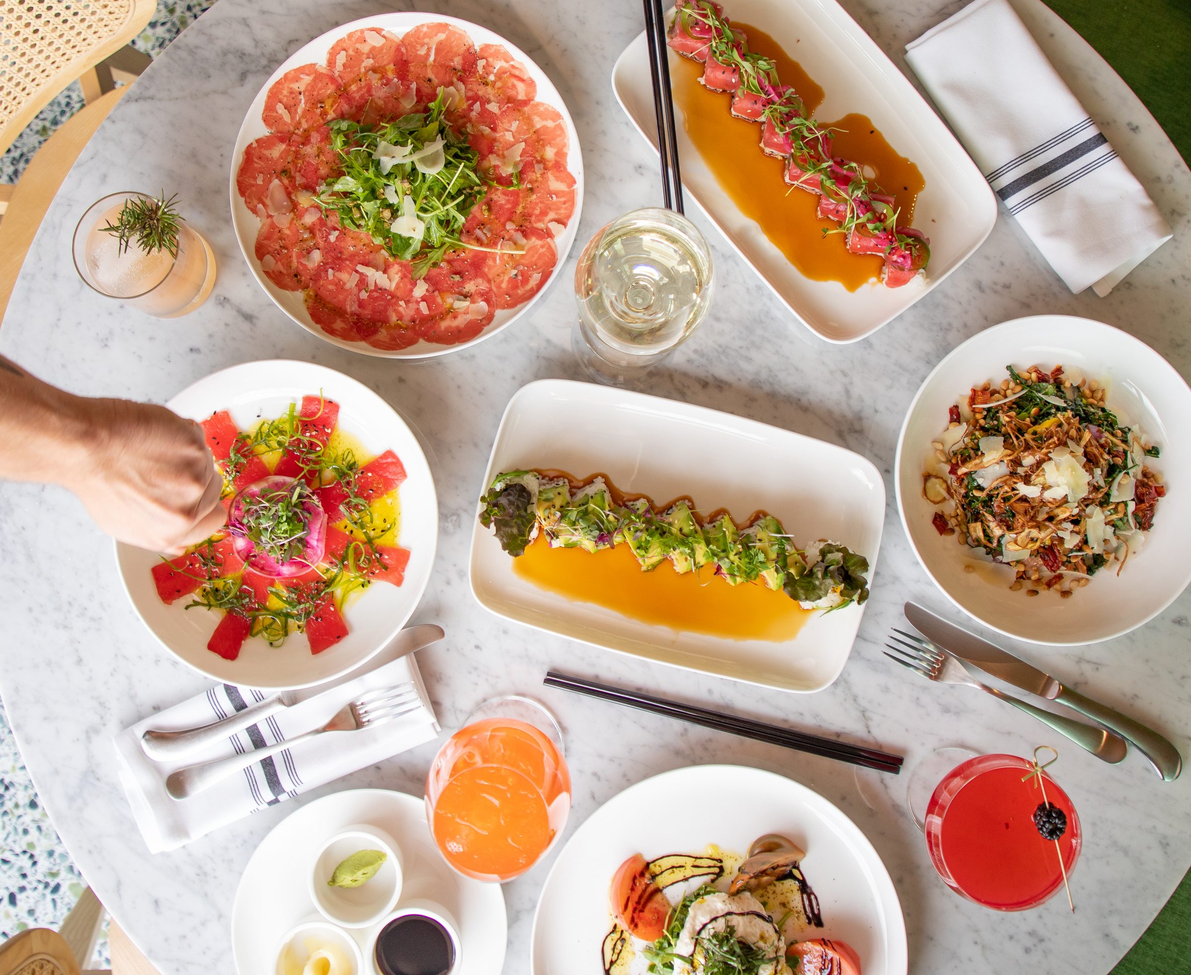 A shared table of dishes at Porta Via California Bistro Bar